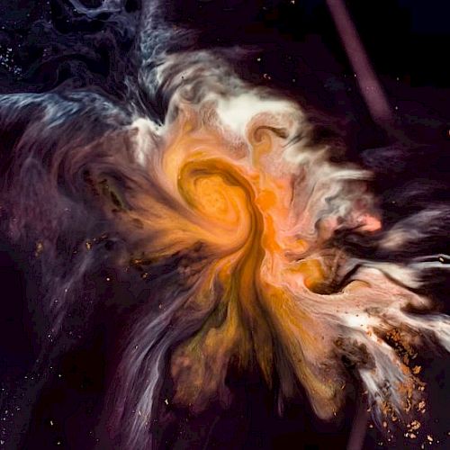 The image shows a swirl of vibrant colors, primarily oranges, and yellows, resembling a cosmic nebula against a dark background.